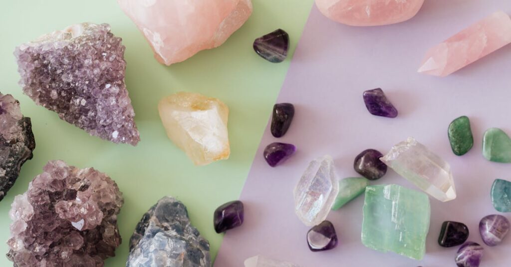 A variety of crystals and gemstones including amethyst and rose quartz on a pastel background.